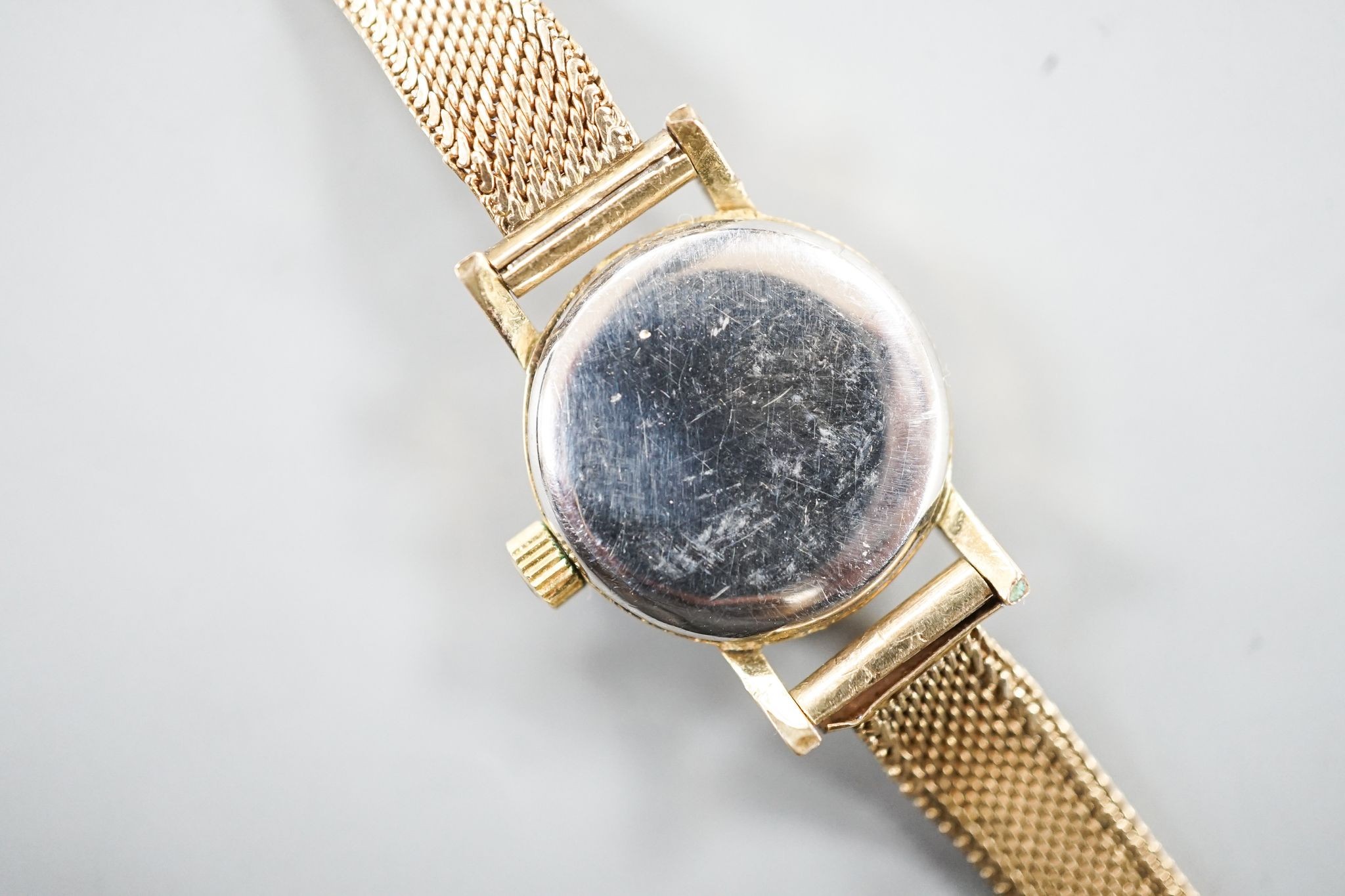 A lady's 1960's steel and gold plated Omega manual wind wrist watch, on an associated 9ct gold bracelet